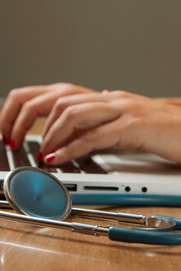 Medical professional helping a patient with hearing care